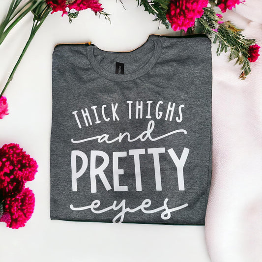 Thick Thighs and Pretty Eyes Printed Graphic T-Shirt Gray - Heather’s Heavenly Boutique 