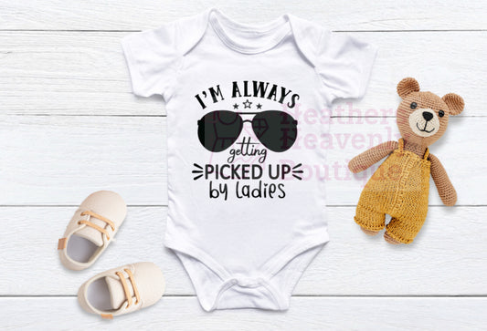 I’m Always Getting Picked Up By The Ladies Baby Onesie