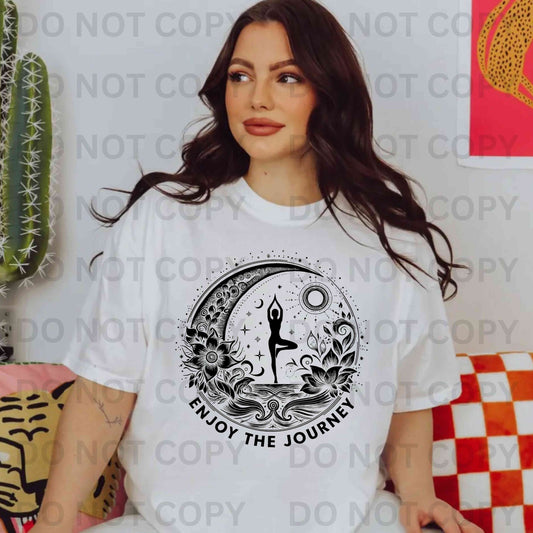 “Boho yoga t-shirt with moon and lotus flower design and woman in tree pose — Enjoy The Journey spiritual mindfulness tee for women