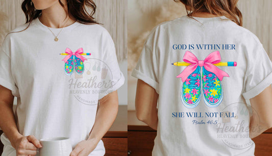 White t-shirt with colorful design and text on front and back, held by a person.