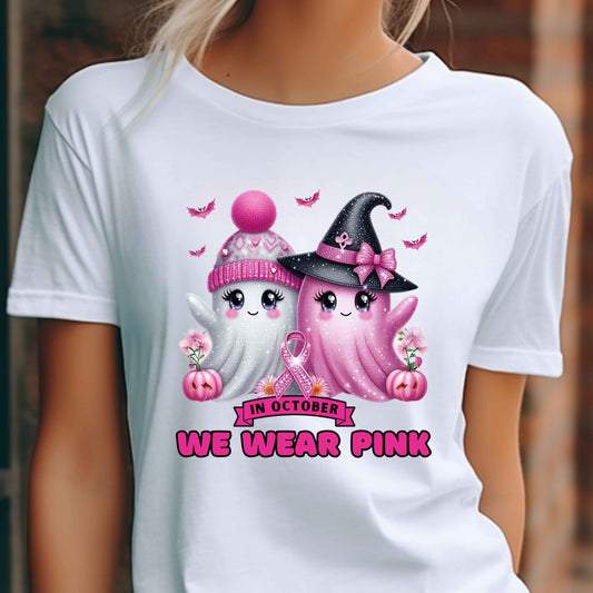 White t-shirt with cartoon ghosts and pink ribbon design, featuring 'In October We Wear Pink' text.