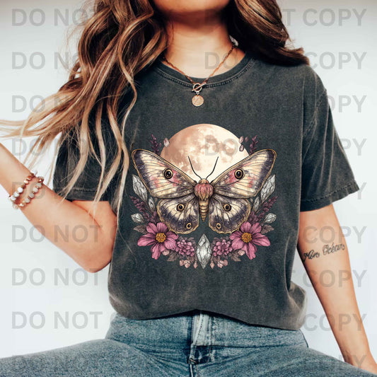Comfort Colors Moth Moon T-shirt with celestial floral design – boho spiritual graphic tee for women, featuring a mystical moth, full moon, and flowers.