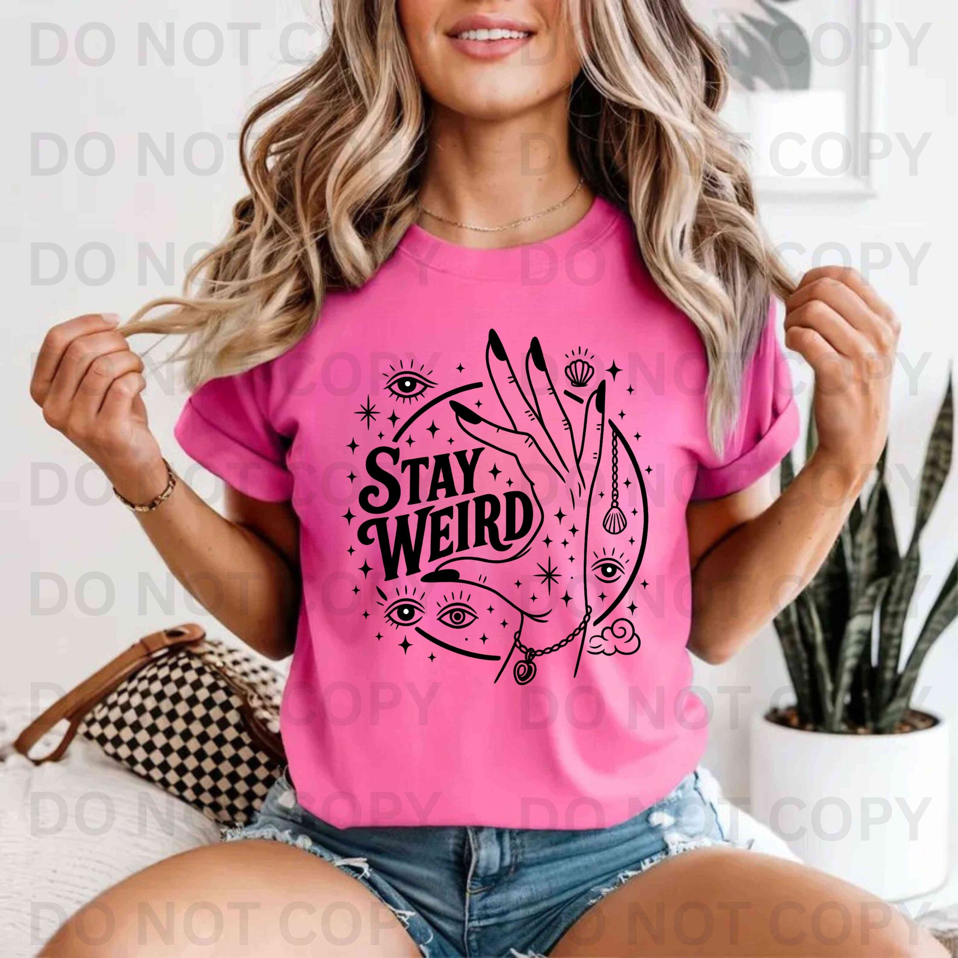 Stay weird third eye hand and eye t-shirt