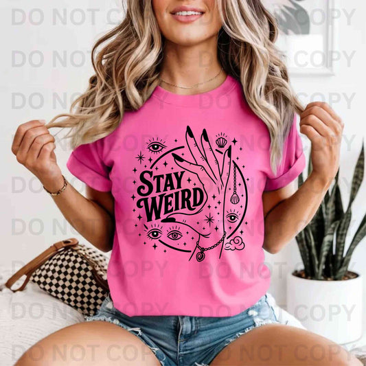 Stay weird third eye hand and eye t-shirt