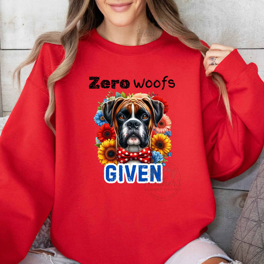 Person wearing a red sweatshirt with a dog graphic and text 'Zero woofs given'.